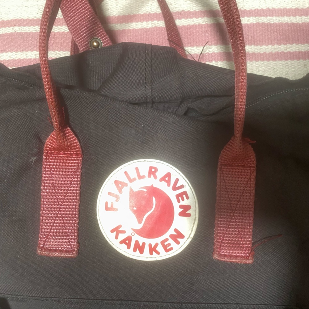 black and rust fjall raven kanken backpack